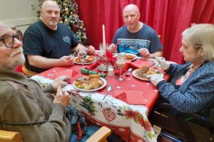 Family members of an Ash Lodge Resident, enjoying Christmas dinner in nursing care